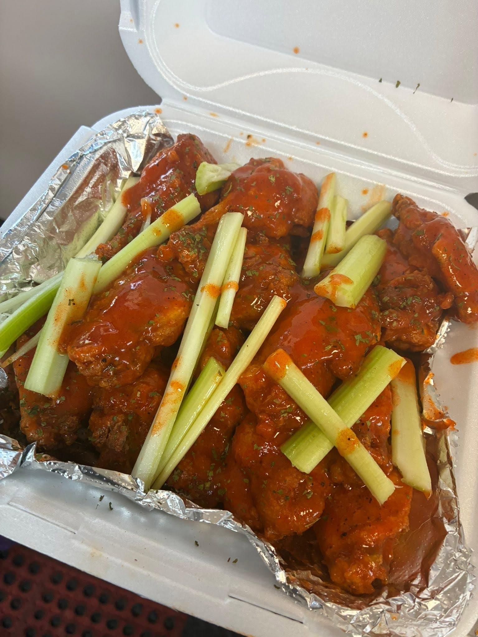 Close-up of sauced party wings