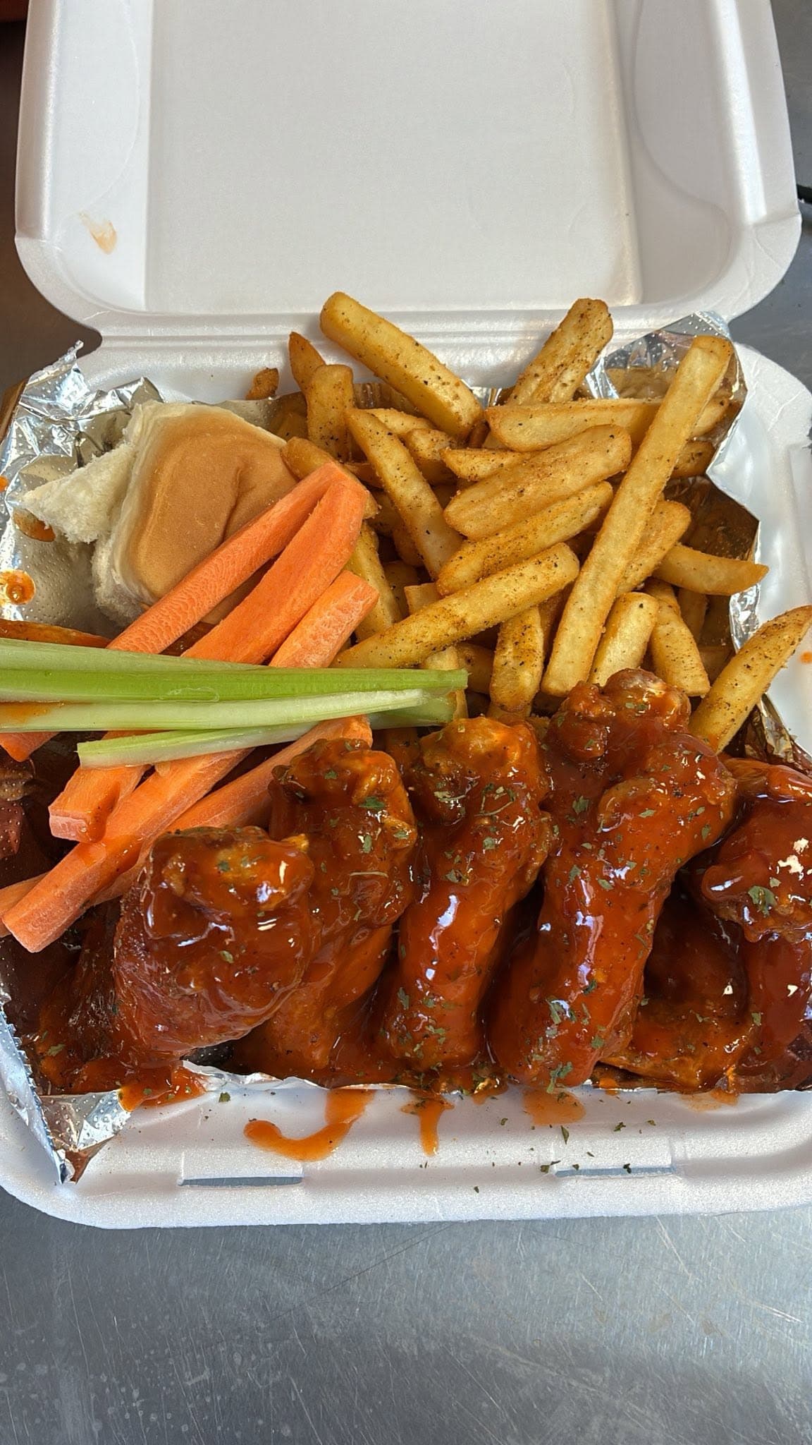 Wings plate with carrots, celery and fries