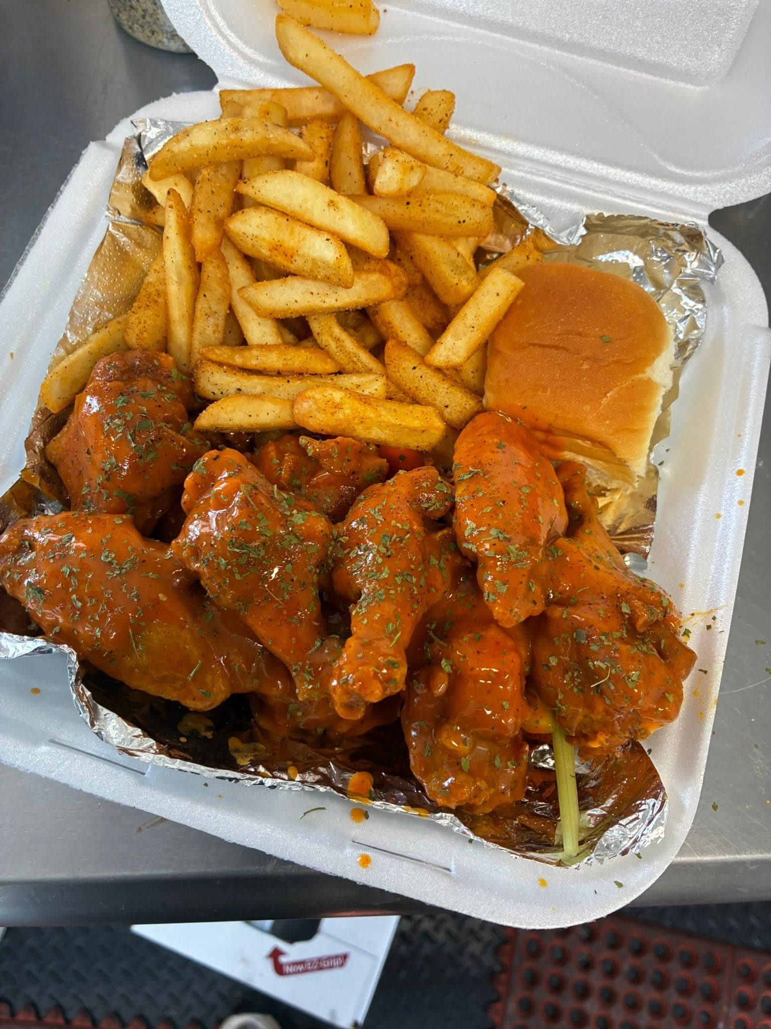 A spread of wings and sides ready for catering