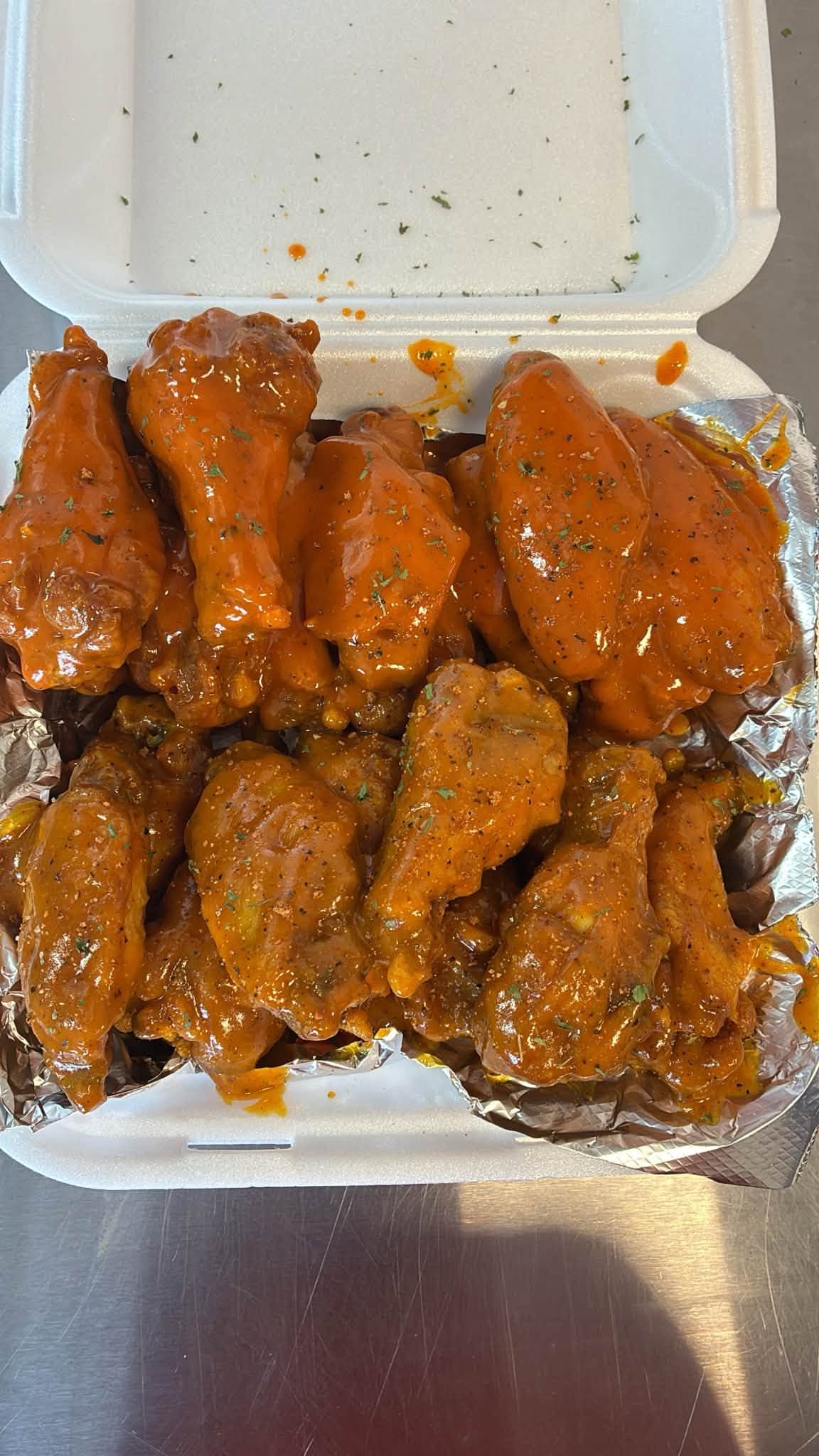 A box of The Chicken Box saucy wings